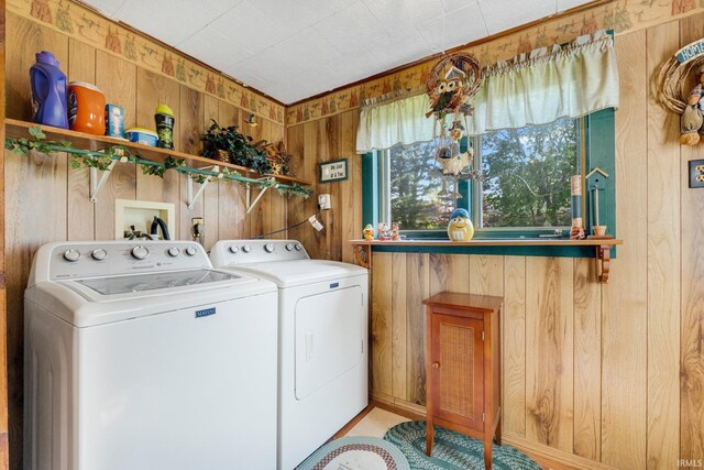 7950 E Metz Rd, Angola, IN 46703 - clothes washing area with wooden walls and washing machine and dryer