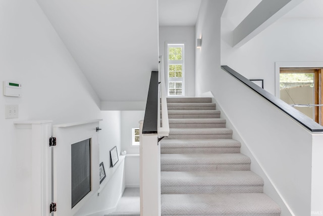 stairway featuring healthy amount of natural light
