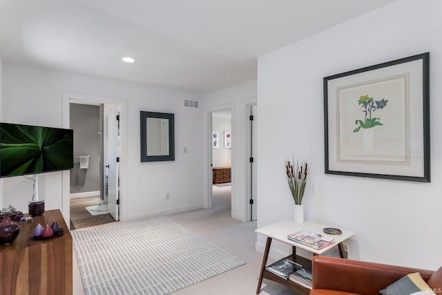 living area with baseboards and recessed lighting