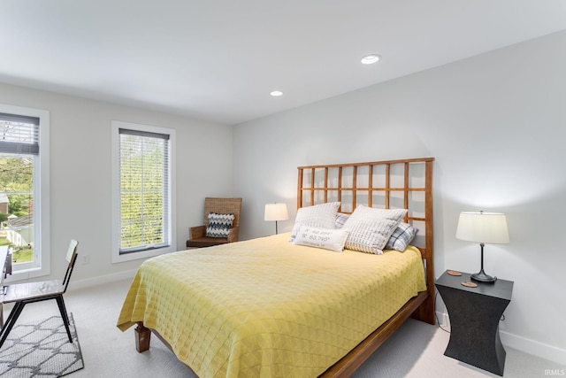 bedroom featuring carpet floors, multiple windows, baseboards, and recessed lighting