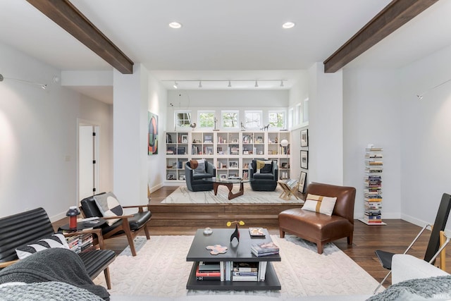 living area with wood finished floors, beam ceiling, baseboards, and recessed lighting