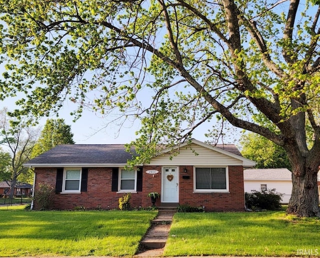 single story home featuring brick siding