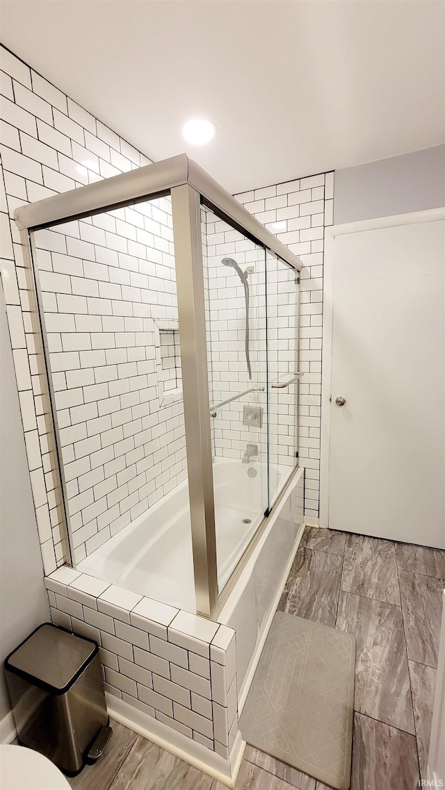 full bathroom with bath / shower combo with glass door and recessed lighting