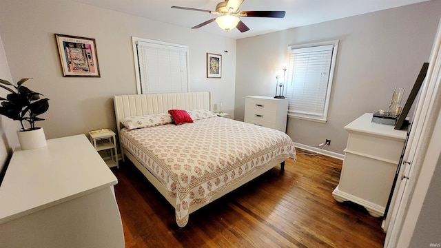 bedroom with dark wood-style flooring, baseboards, and ceiling fan