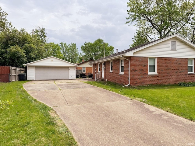 single story home with a detached garage, brick siding, and an outdoor structure