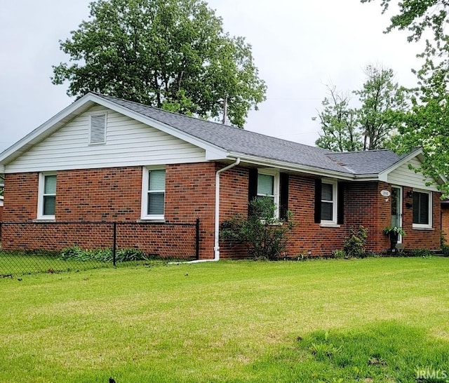 ranch-style house with brick siding and a shingled roof
