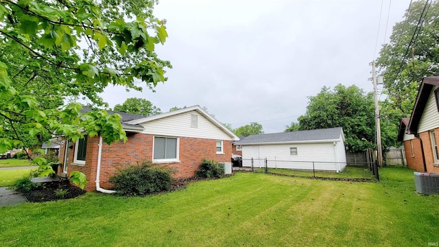 back of property with brick siding and central AC unit