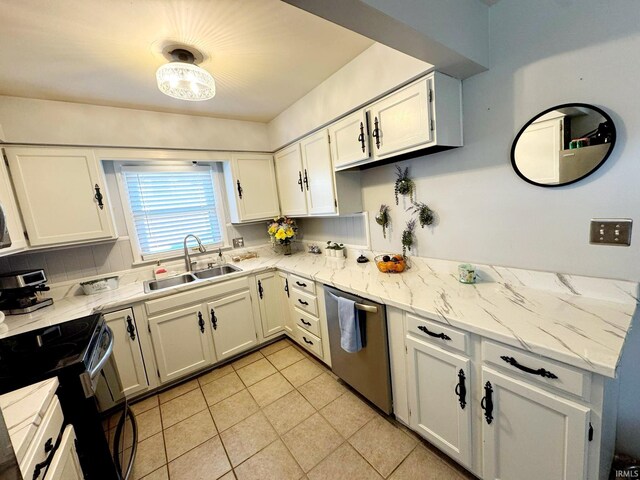 kitchen featuring a sink, dishwasher, black range with electric stovetop, light tile patterned floors, and white cabinetry