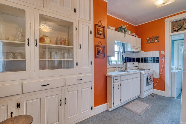 832 N Two Story Rd, Boonville, IN 47601 - kitchen with white gas range, under cabinet range hood, a sink, and white cabinets