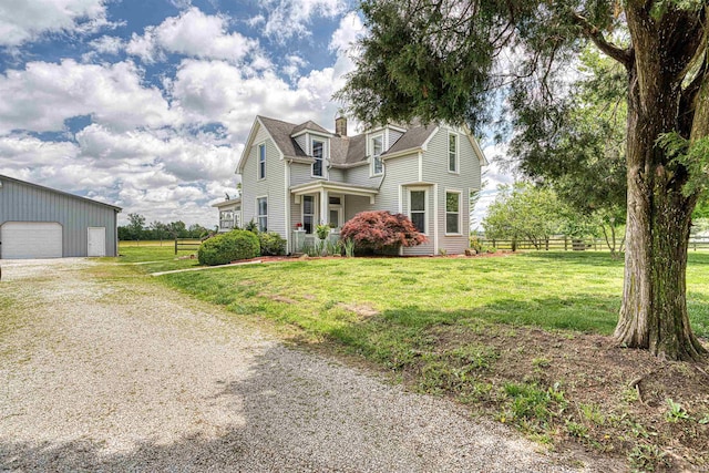 832 N Two Story Rd, Boonville, IN 47601 - view of front of home with a garage, an outbuilding, gravel driveway, a chimney, and a shingled roof