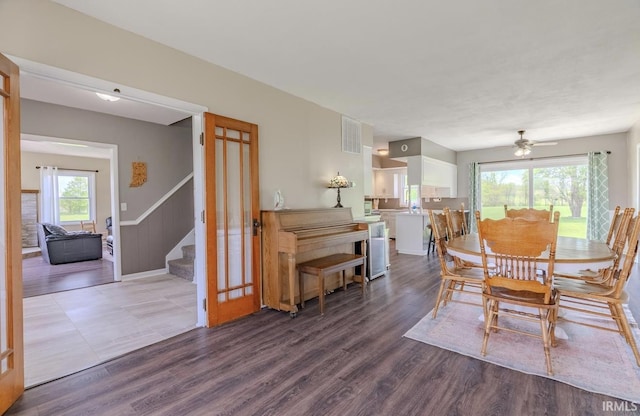 7325 E State Road 218, Lafontaine, IN 46940 - dining room featuring stairs, wood finished floors, and ceiling fan