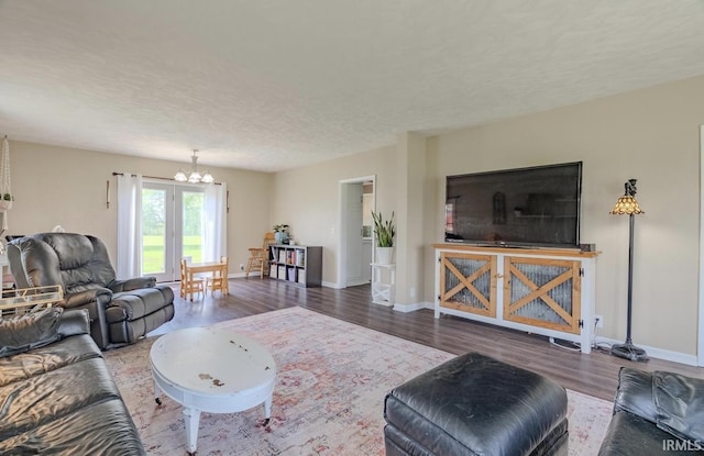 7325 E State Road 218, Lafontaine, IN 46940 - living room with a chandelier, wood finished floors, and baseboards