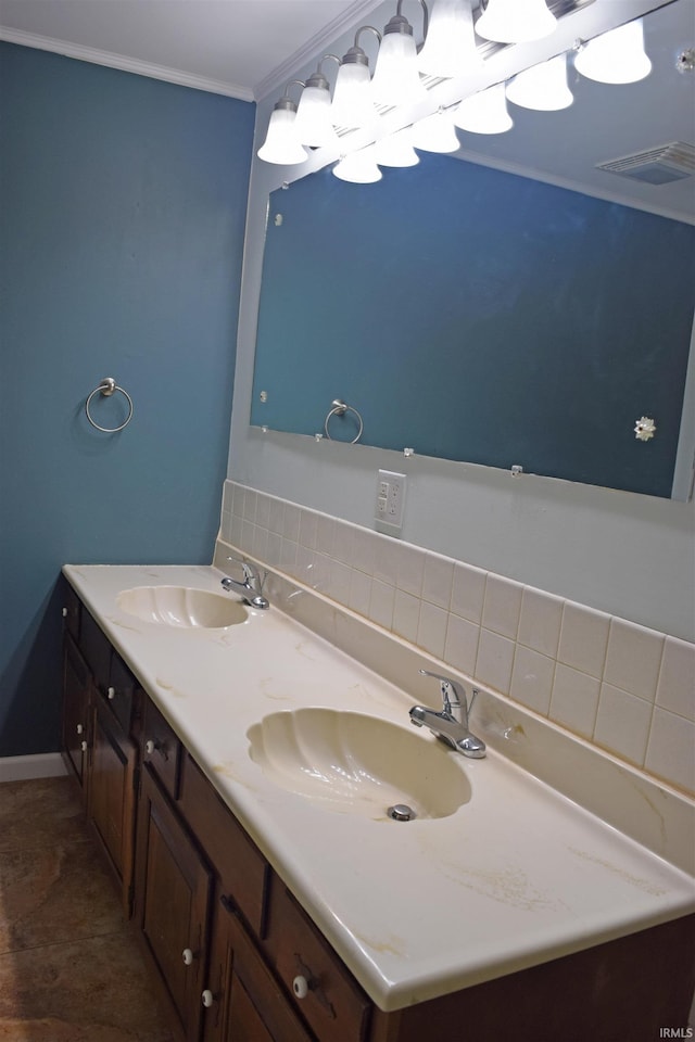 bathroom with double vanity, ornamental molding, and baseboards