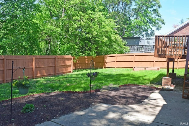 view of yard with a deck