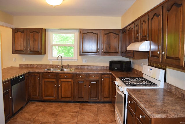 kitchen featuring white range with gas stovetop, a sink, black microwave, stainless steel dishwasher, and under cabinet range hood