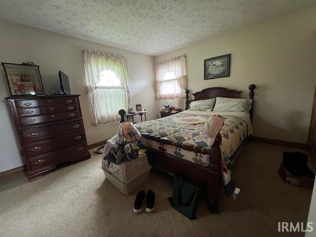 3800 S 175 W, Lafayette, IN 47909 - bedroom with a textured ceiling, light colored carpet, and baseboards
