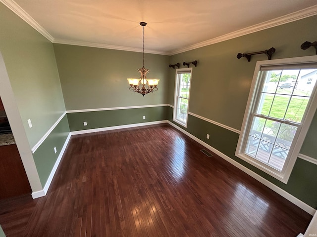 unfurnished dining area featuring dark wood-type flooring, baseboards, a chandelier, and ornamental molding