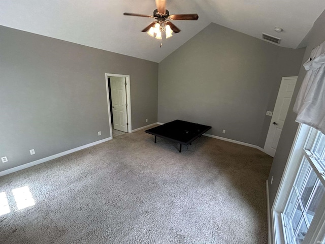unfurnished bedroom with lofted ceiling, carpet flooring, baseboards, and a ceiling fan