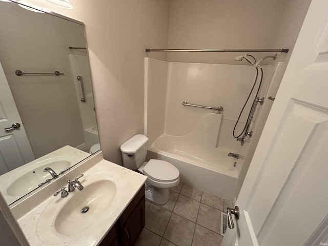 full bathroom with tile patterned flooring, toilet, vanity, and shower / tub combination