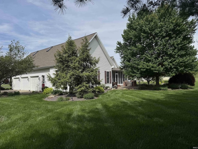 view of side of property with a yard