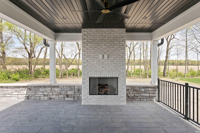 15171 Gossamer Trl, Granger, IN 46530 - view of patio featuring an outdoor brick fireplace and a ceiling fan