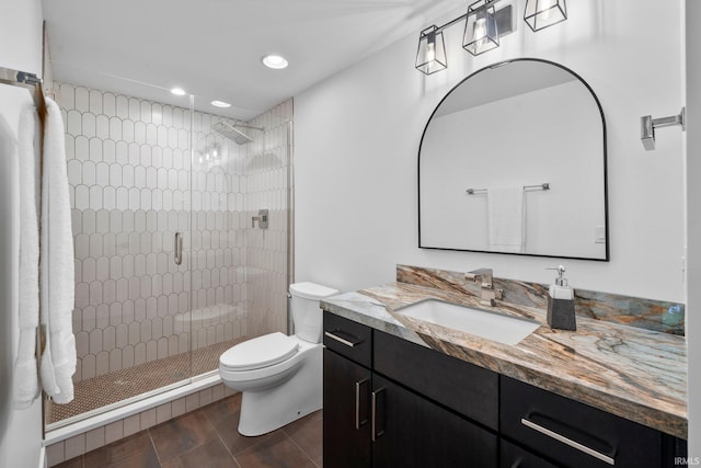 15171 Gossamer Trl, Granger, IN 46530 - full bathroom with vanity, a shower stall, toilet, recessed lighting, and wood finished floors