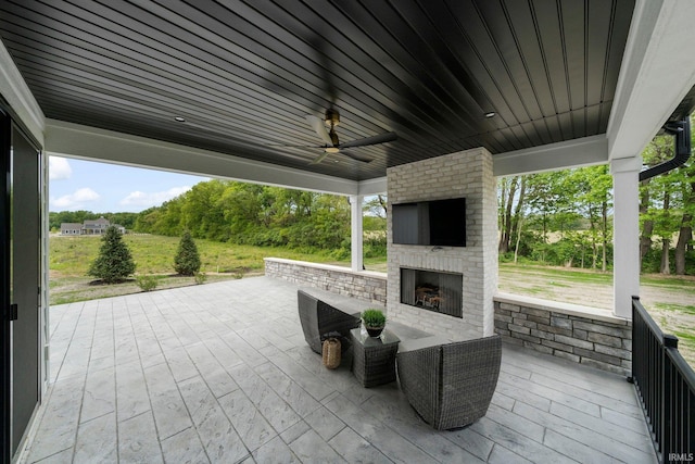 15171 Gossamer Trl, Granger, IN 46530 - view of patio / terrace featuring an outdoor brick fireplace and a ceiling fan