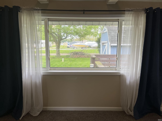 7374 W Upper Bensart Dr, Claypool, IN 46510 - detailed view of carpet and baseboards