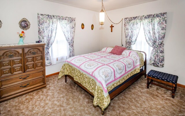 bedroom featuring carpet flooring and baseboards