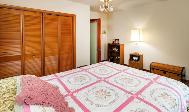 bedroom featuring a closet and a chandelier