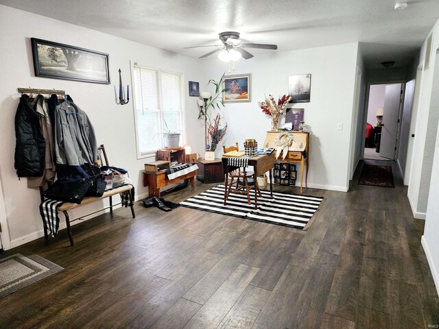 dining area featuring ceiling fan, wood finished floors, and baseboards