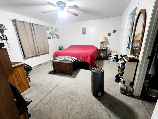 bedroom featuring carpet floors, ceiling fan, and baseboards