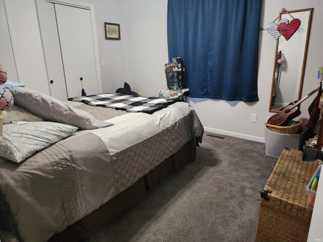 bedroom with carpet flooring and baseboards