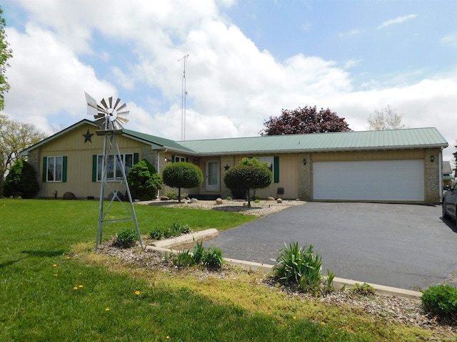 2887 S 1475 E, Akron, IN 46910 - ranch-style home featuring asphalt driveway, a garage, a front yard, and metal roof