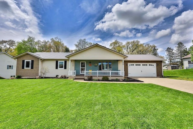 single story home featuring covered porch, metal roof, driveway, an attached garage, and a front yard