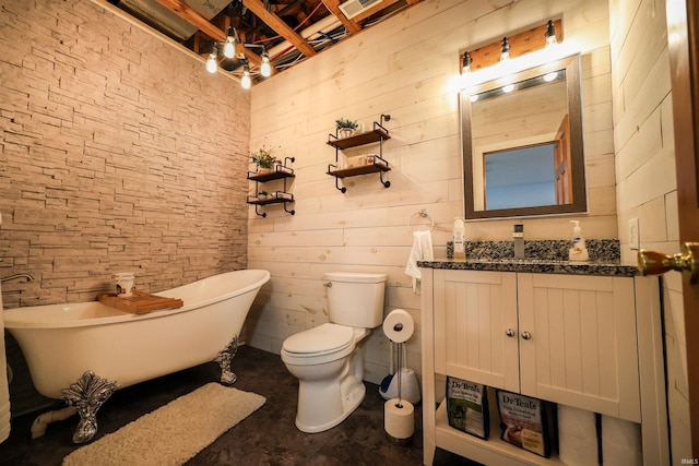bathroom featuring a soaking tub, toilet, and vanity