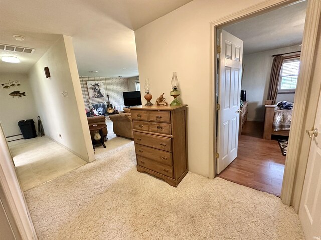 52 S 950 E, Greentown, IN 46936 - hall featuring light colored carpet and a baseboard heating unit