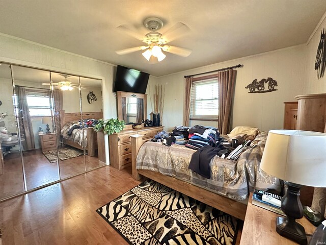 52 S 950 E, Greentown, IN 46936 - bedroom with ornamental molding, wood finished floors, a closet, and a ceiling fan