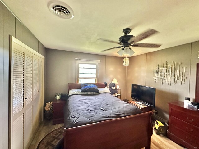 52 S 950 E, Greentown, IN 46936 - bedroom featuring wood finished floors, a closet, and a ceiling fan