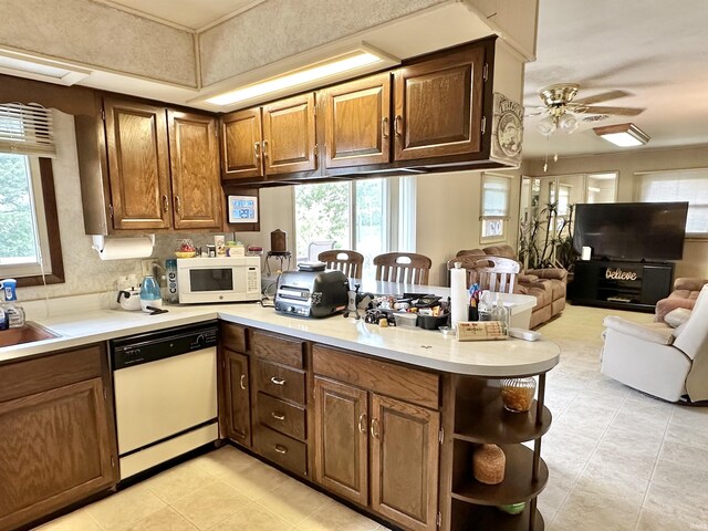 52 S 950 E, Greentown, IN 46936 - kitchen with white appliances, a peninsula, open floor plan, ceiling fan, and light countertops
