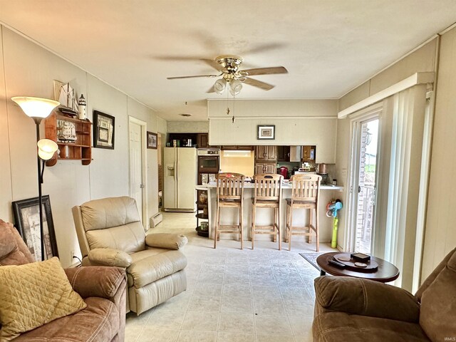 52 S 950 E, Greentown, IN 46936 - living area featuring ceiling fan and light tile patterned floors