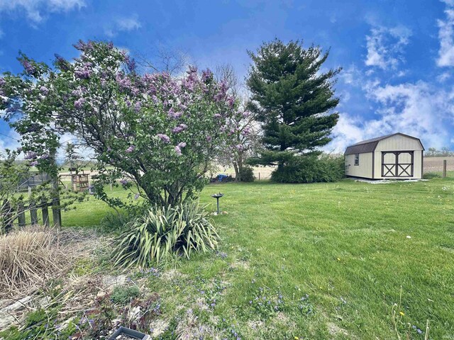 52 S 950 E, Greentown, IN 46936 - view of green lawn featuring an outdoor structure and a storage shed