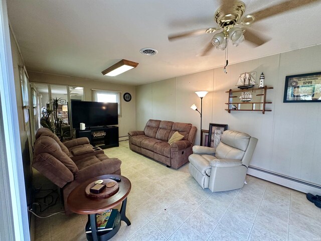 52 S 950 E, Greentown, IN 46936 - living room featuring a ceiling fan and a baseboard radiator