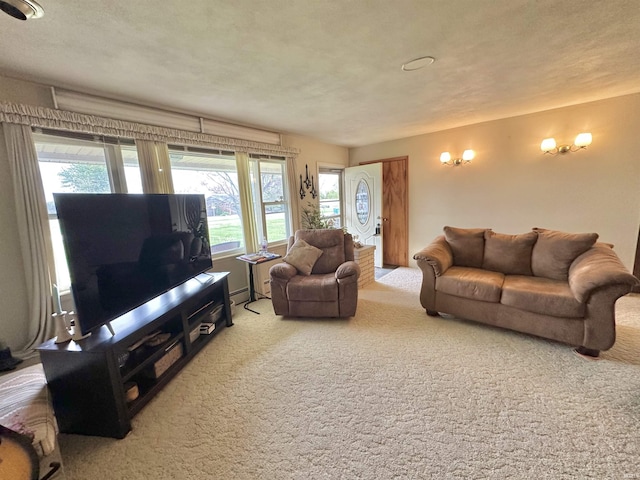 52 S 950 E, Greentown, IN 46936 - living area featuring carpet flooring and a baseboard heating unit
