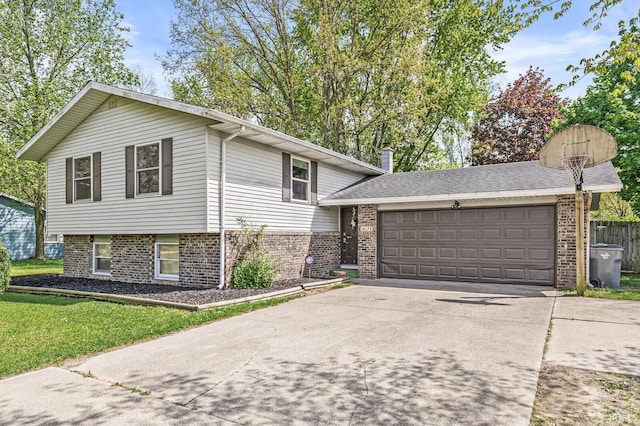 split level home with brick siding, driveway, an attached garage, and a front lawn