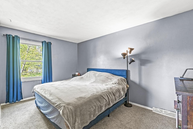bedroom with carpet and baseboards