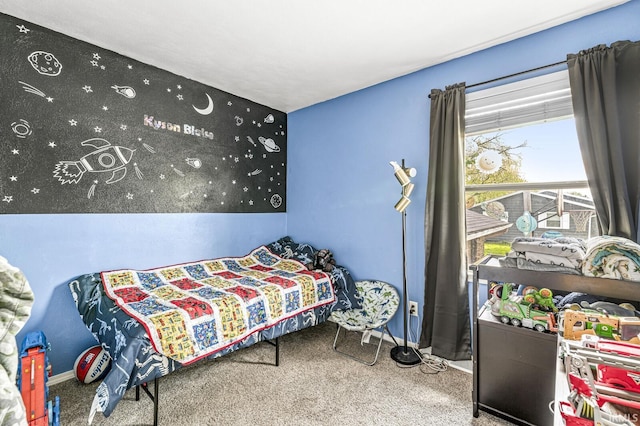 bedroom featuring carpet floors and baseboards