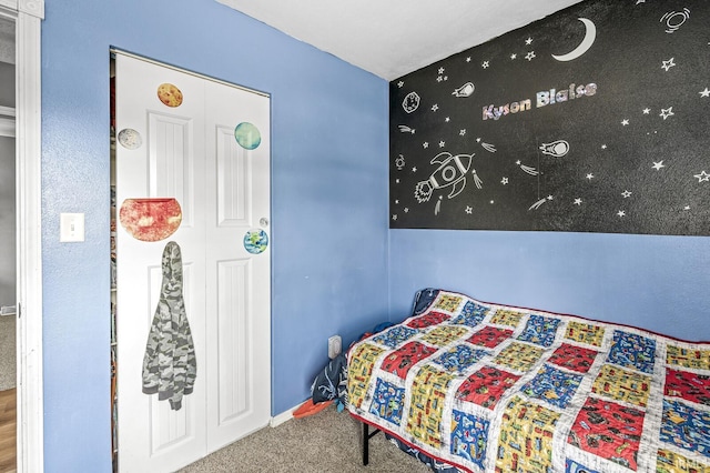 carpeted bedroom with baseboards
