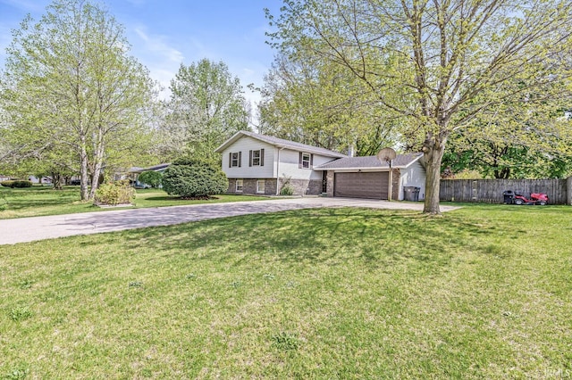 tri-level home featuring concrete driveway, an attached garage, and brick siding
