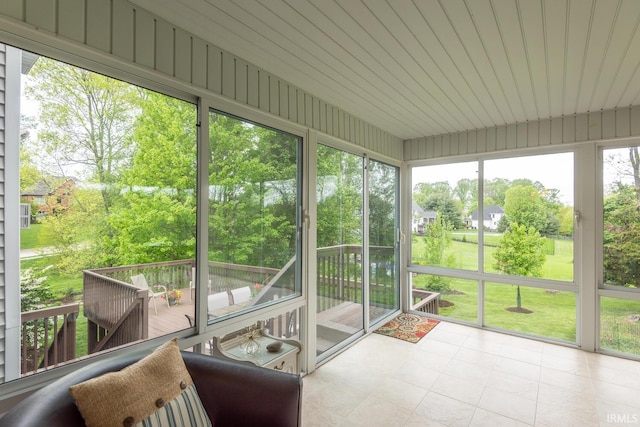 sunroom / solarium with outdoor dining area